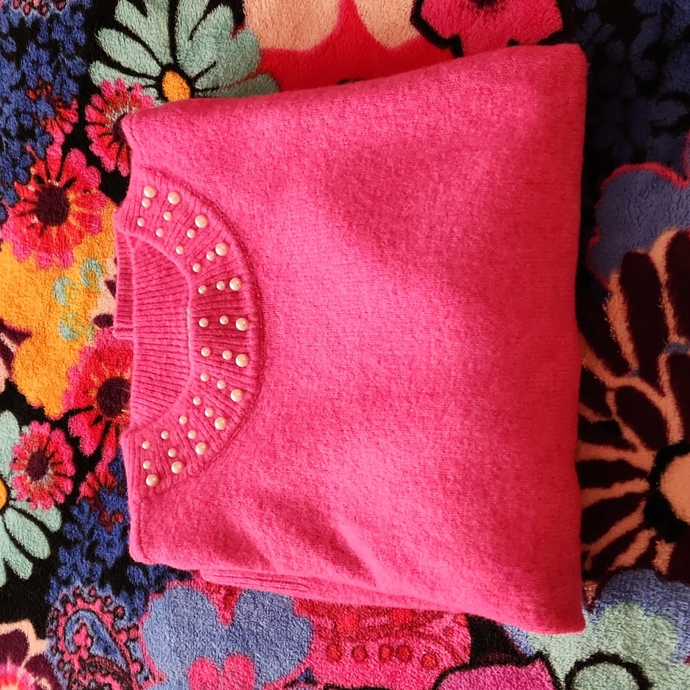 Pink sweater with pearl neckline